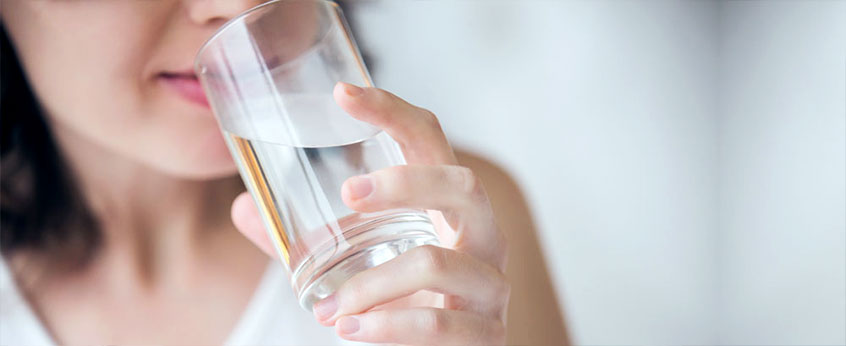 woman drinking tap water